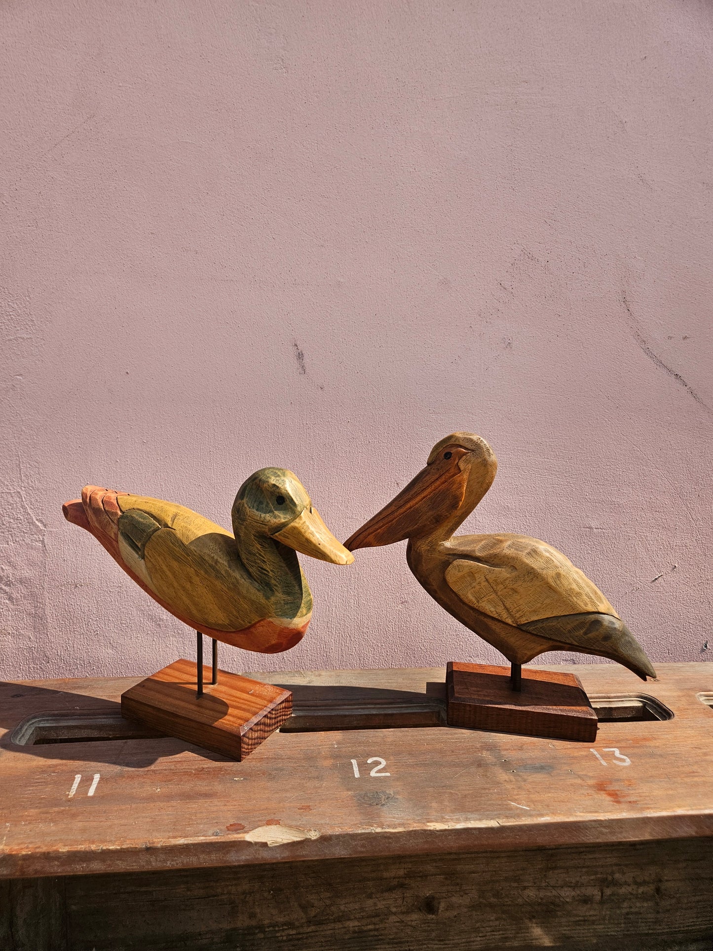 Pair of wooden bird figurines