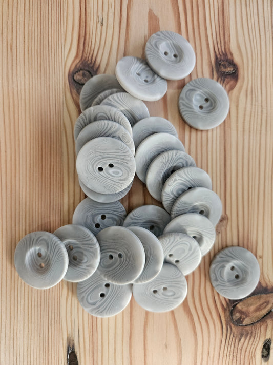Large grey swirl buttons