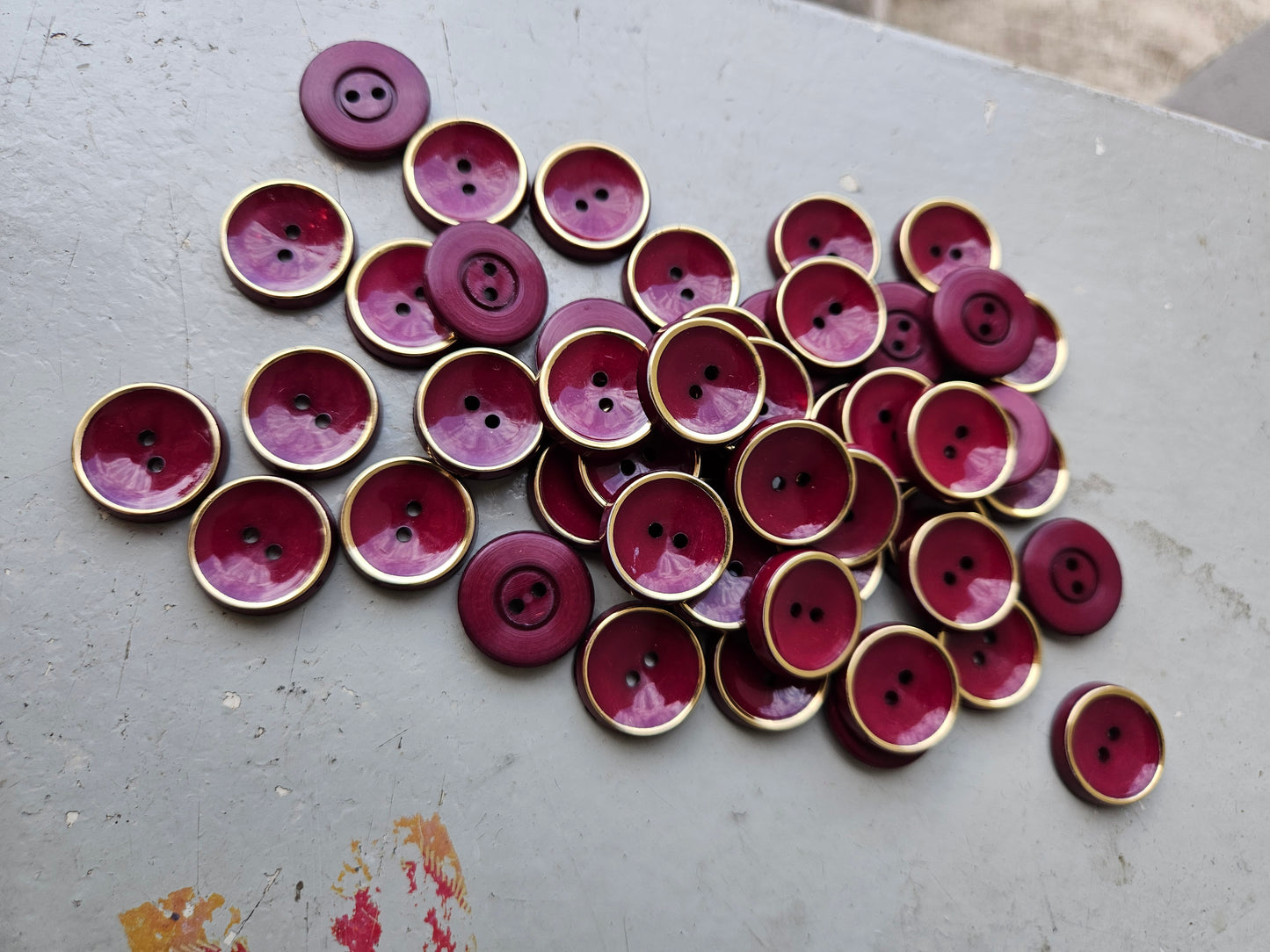 Burgundy and gold buttons