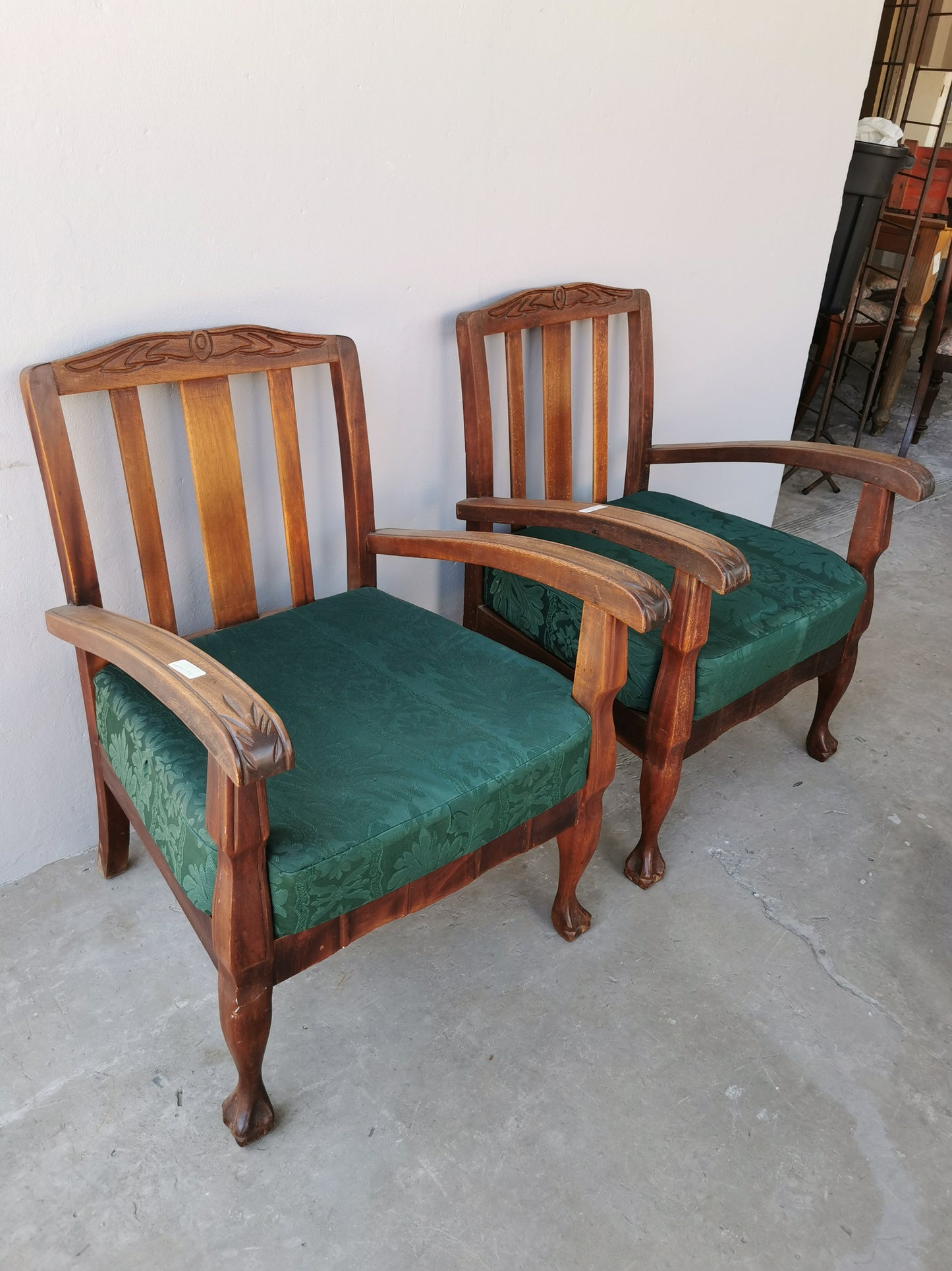 Pair of wooden arm chairs