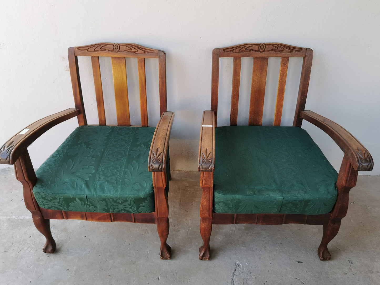 Pair of wooden arm chairs