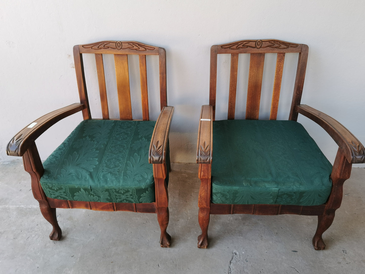 Pair of wooden arm chairs