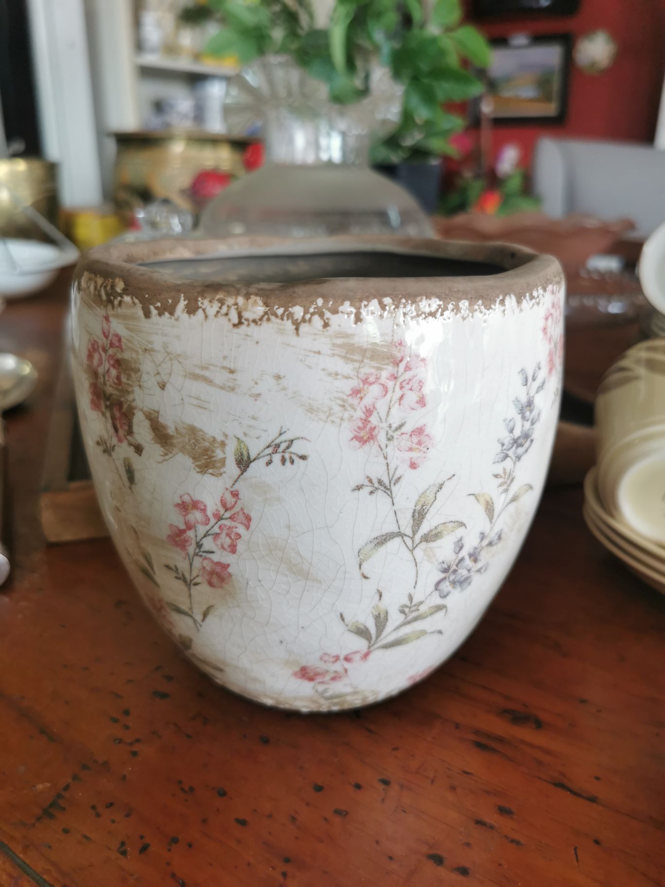 Plant pot with muted red and black flowers