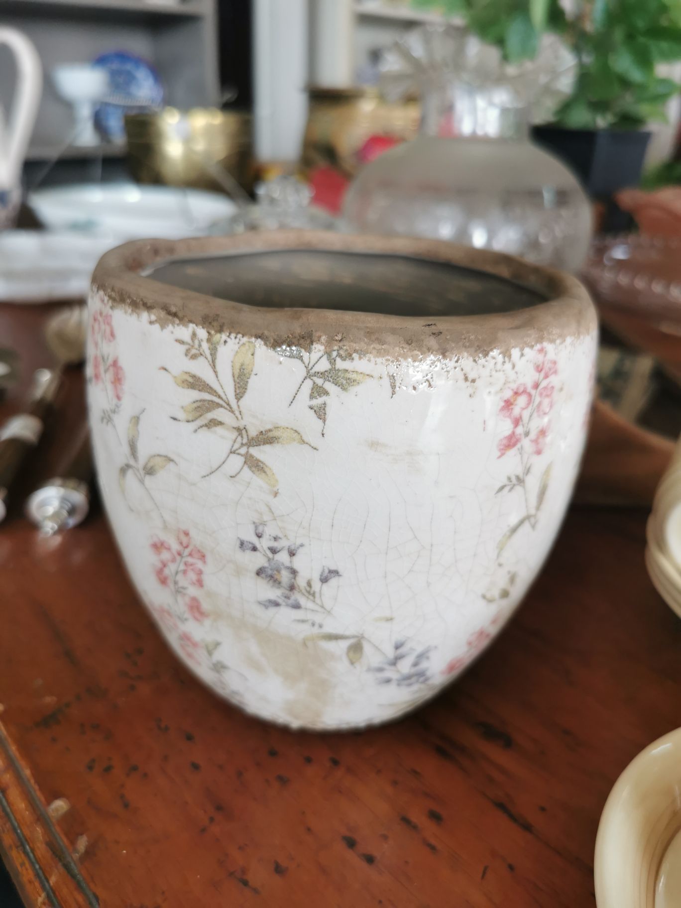Plant pot with muted red and black flowers