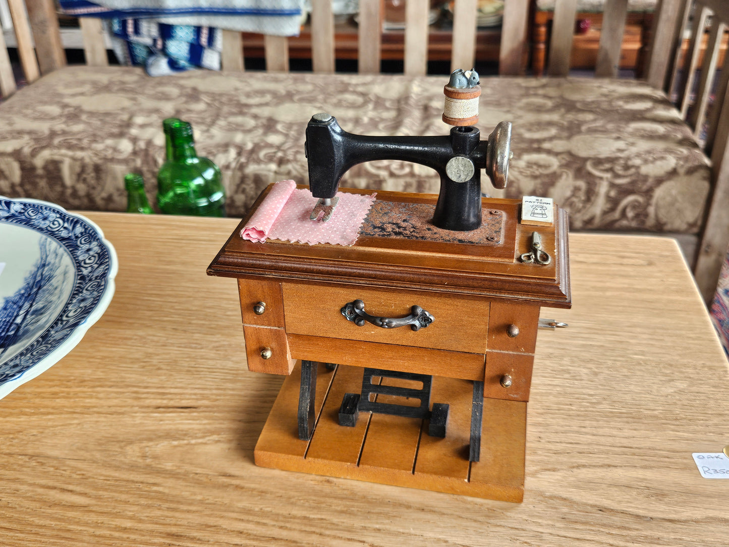 Miniature musical sewing machine
