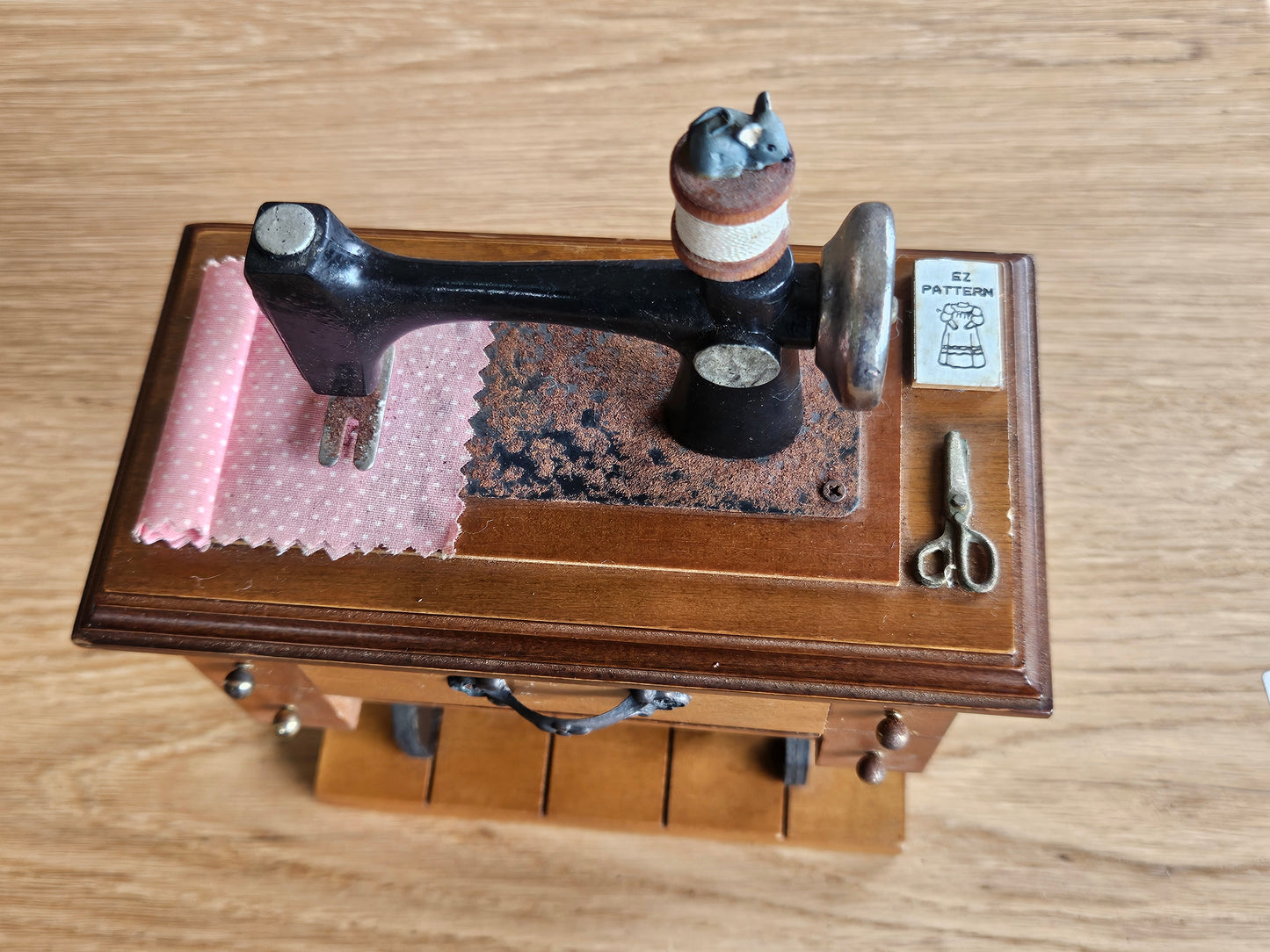 Miniature musical sewing machine