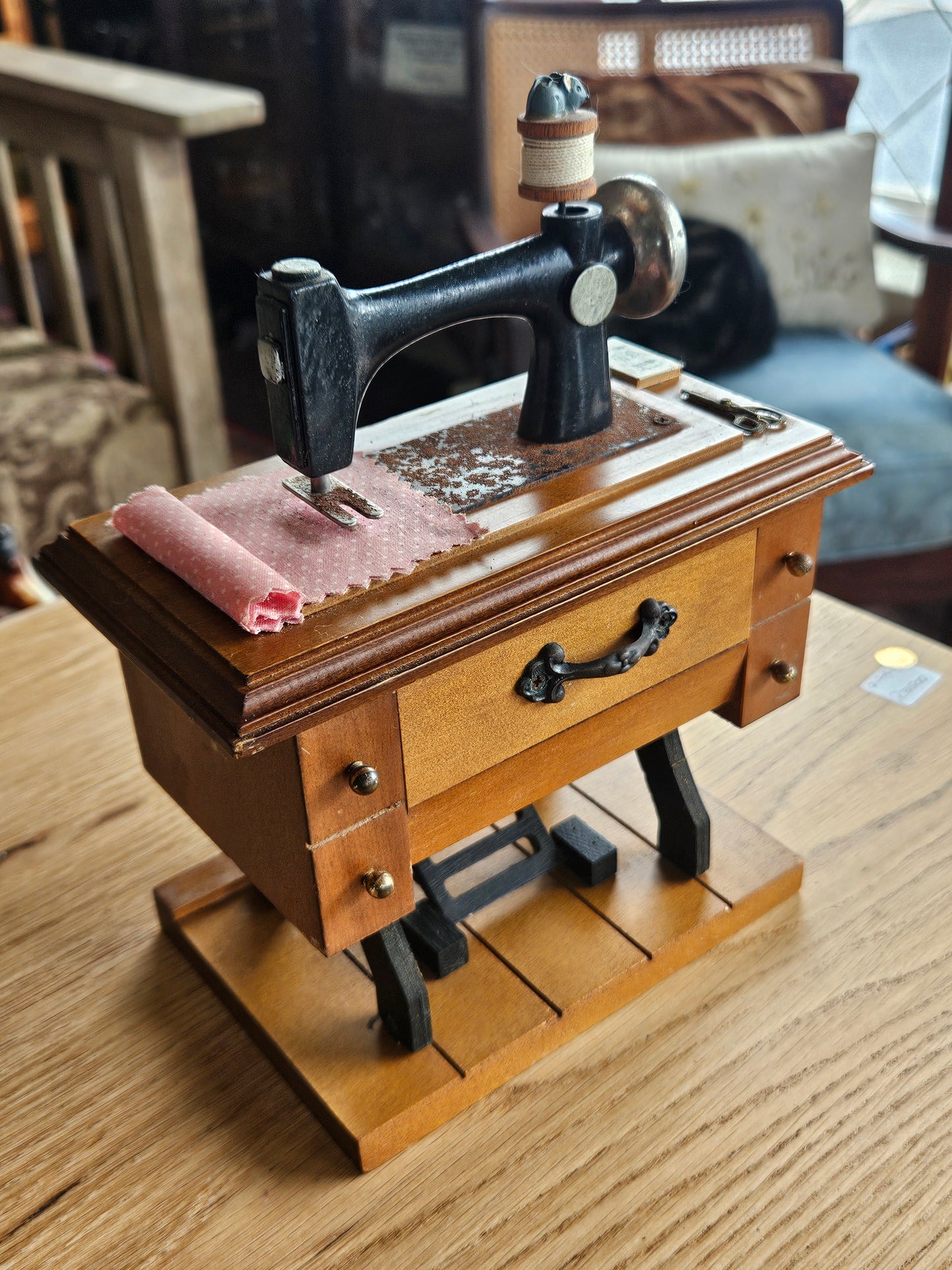 Miniature musical sewing machine