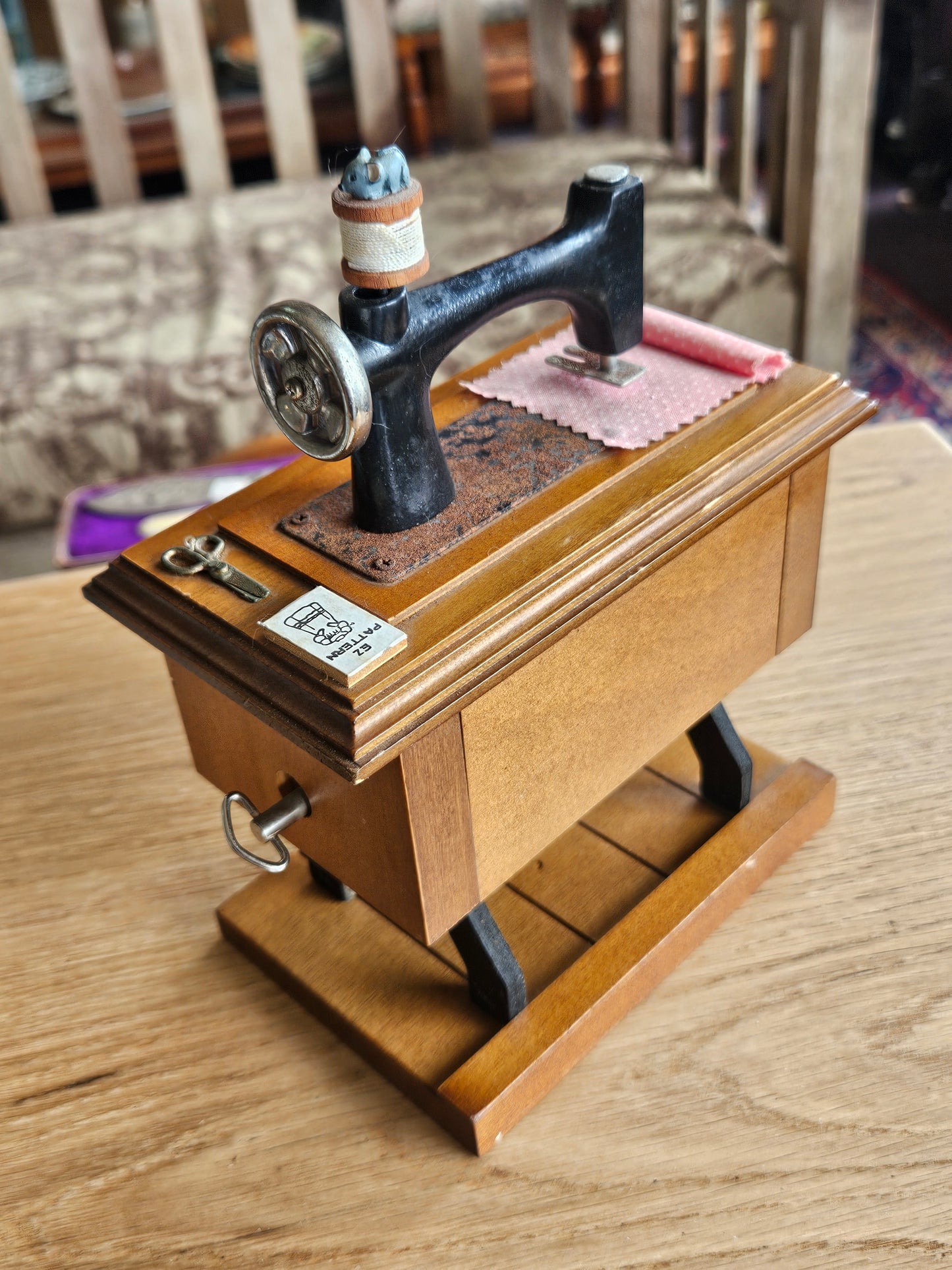 Miniature musical sewing machine