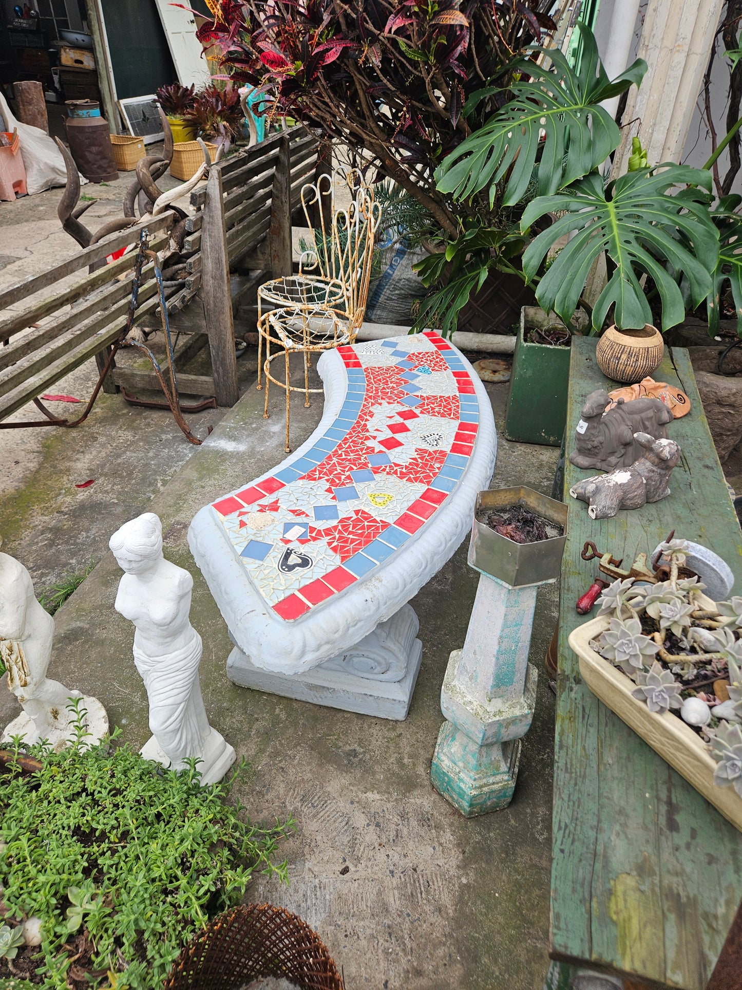 Curved concrete garden bench