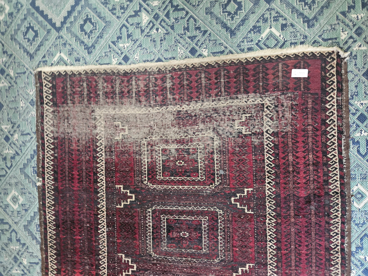 Worn Persian carpet
