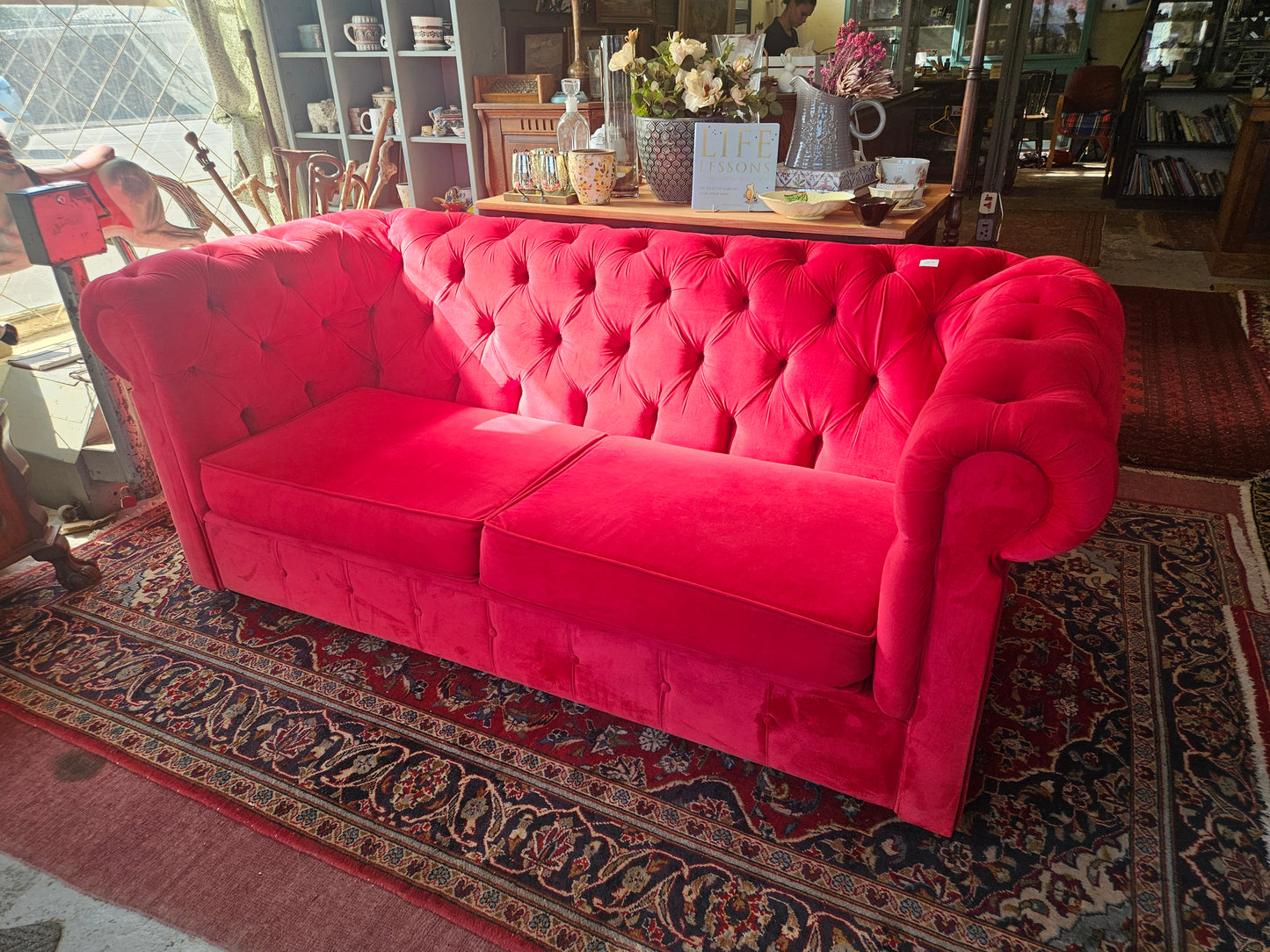 Red Chesterfield style couch