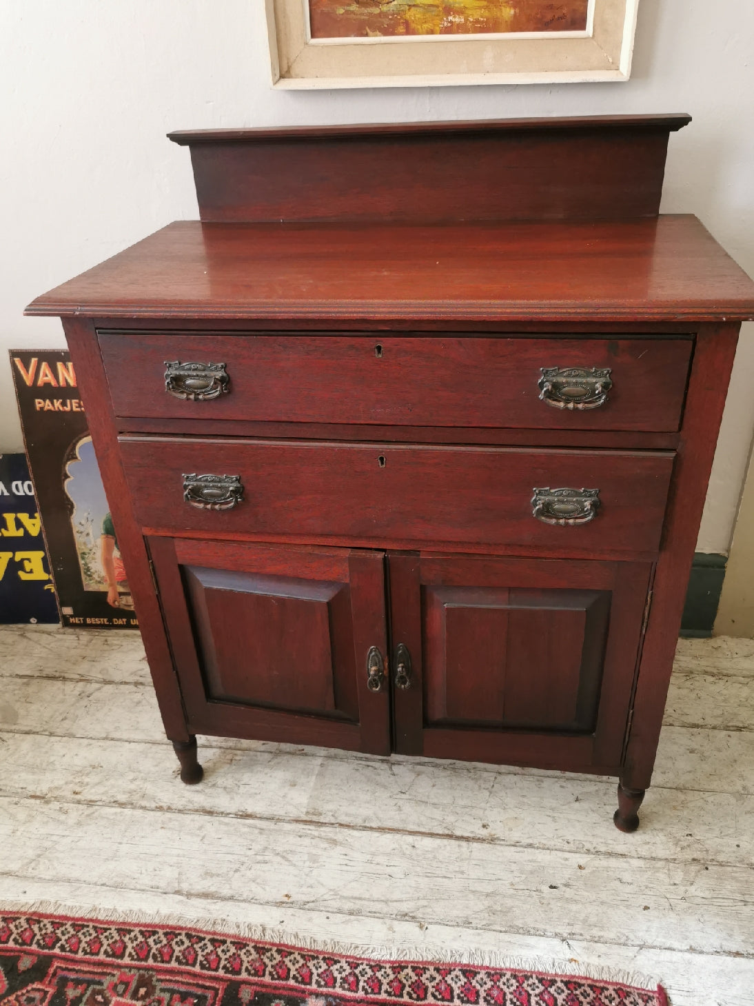 Teak cupboard with drawers and doors