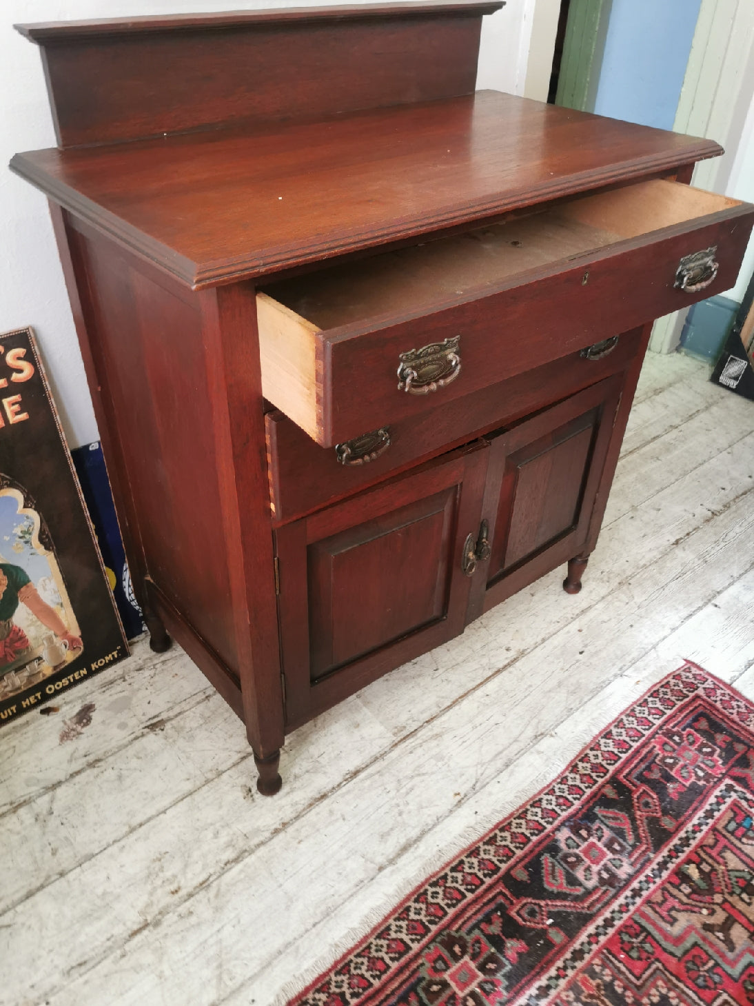Teak cupboard with drawers and doors