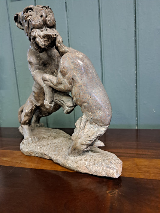 Soapstone figurine of lion and prey