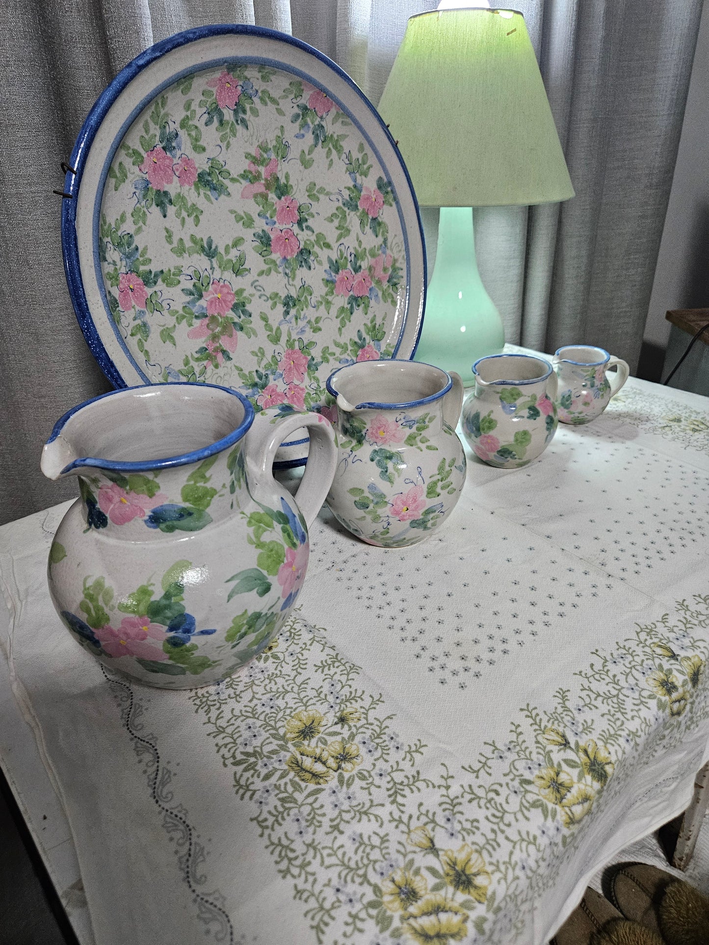 Floral pottery plate and jugs