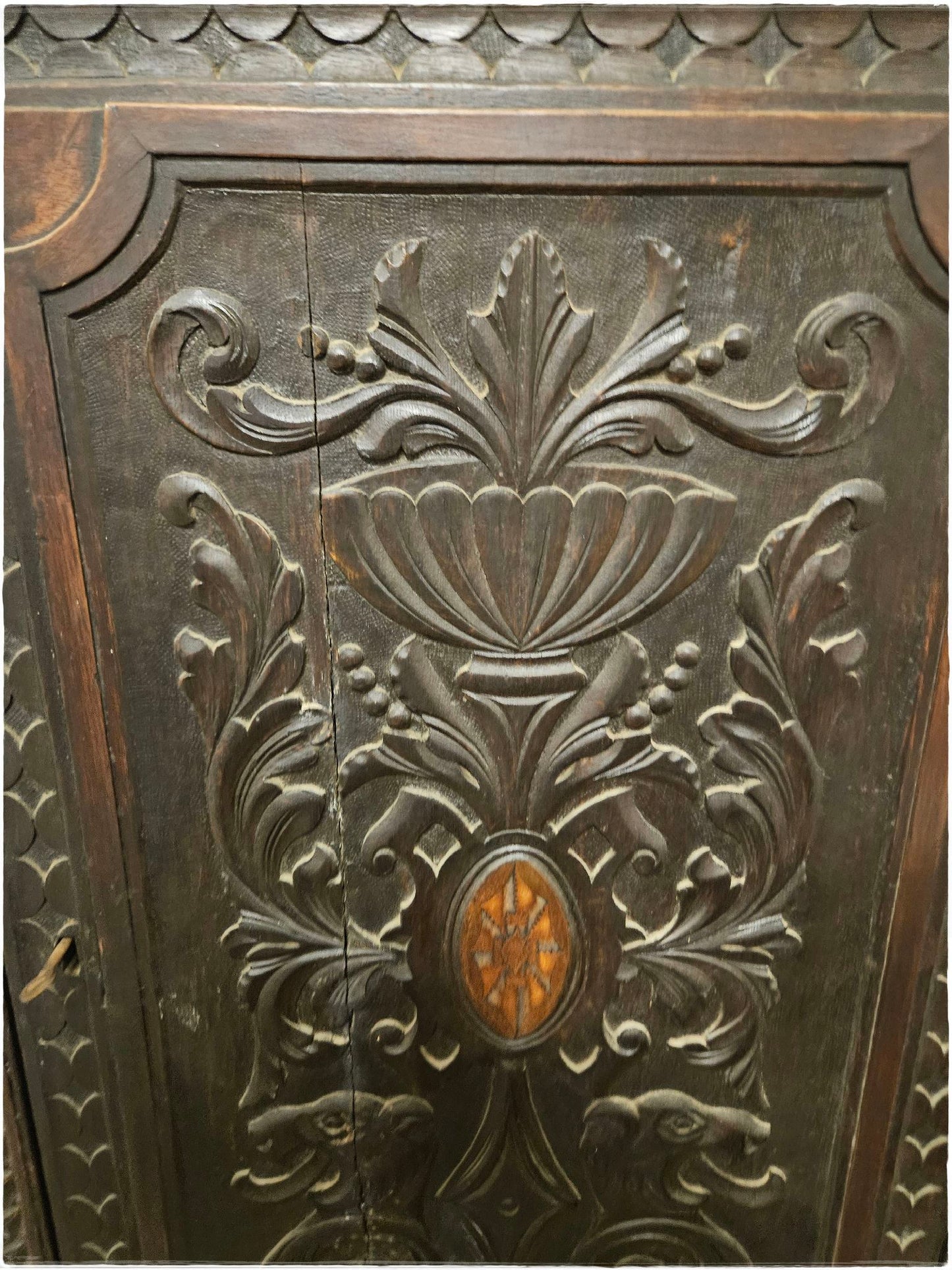 Ornately carved corner cabinet