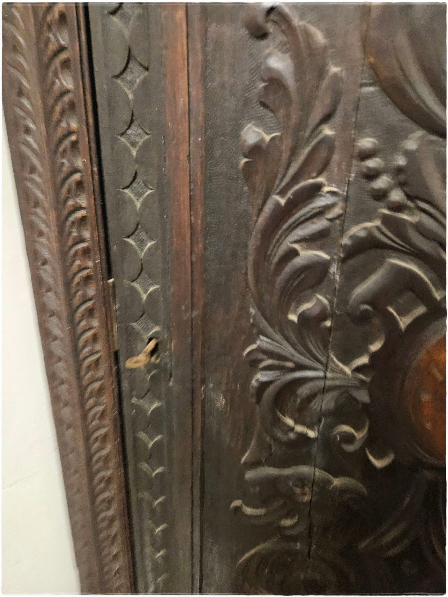 Ornately carved corner cabinet