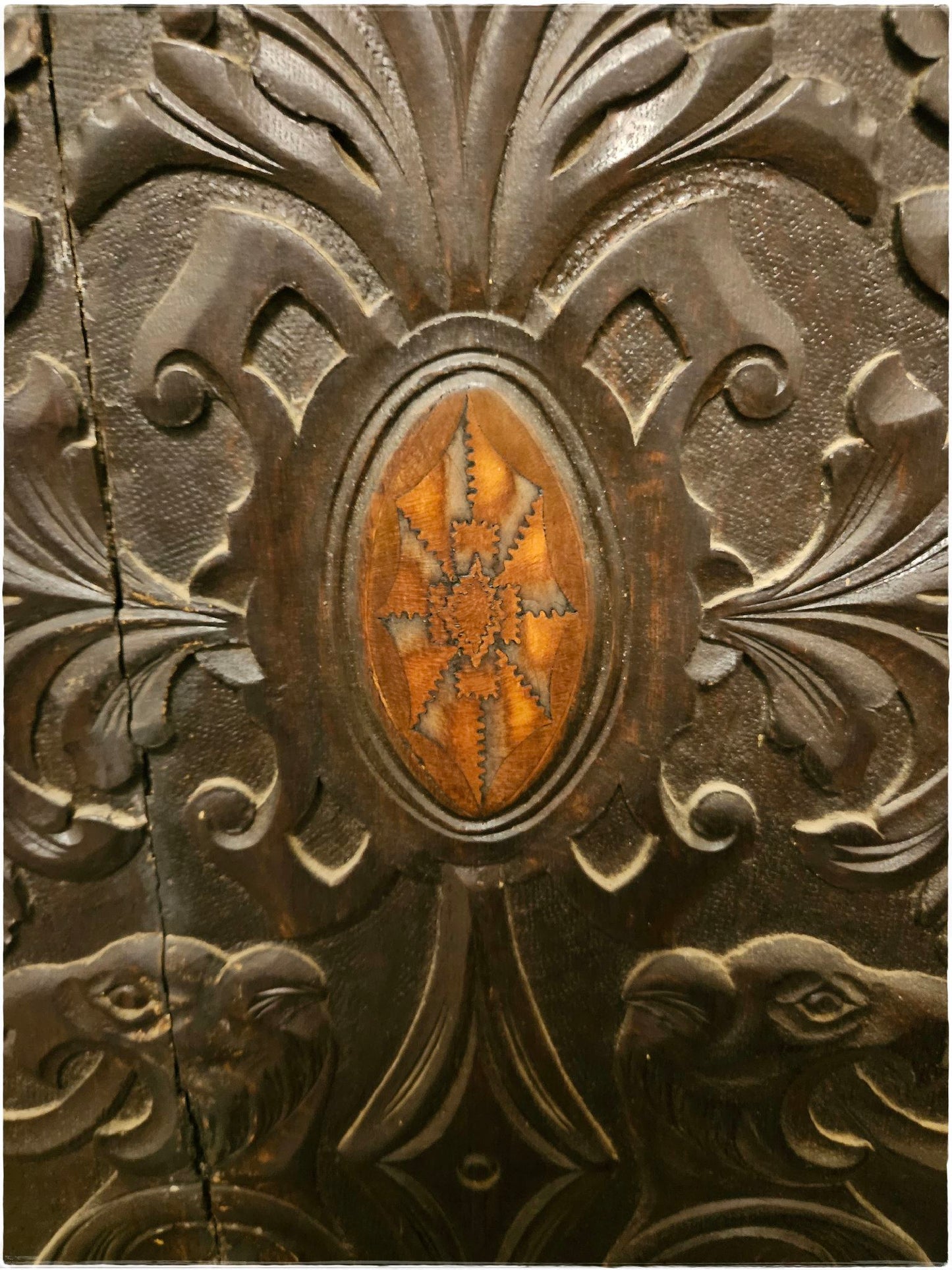 Ornately carved corner cabinet