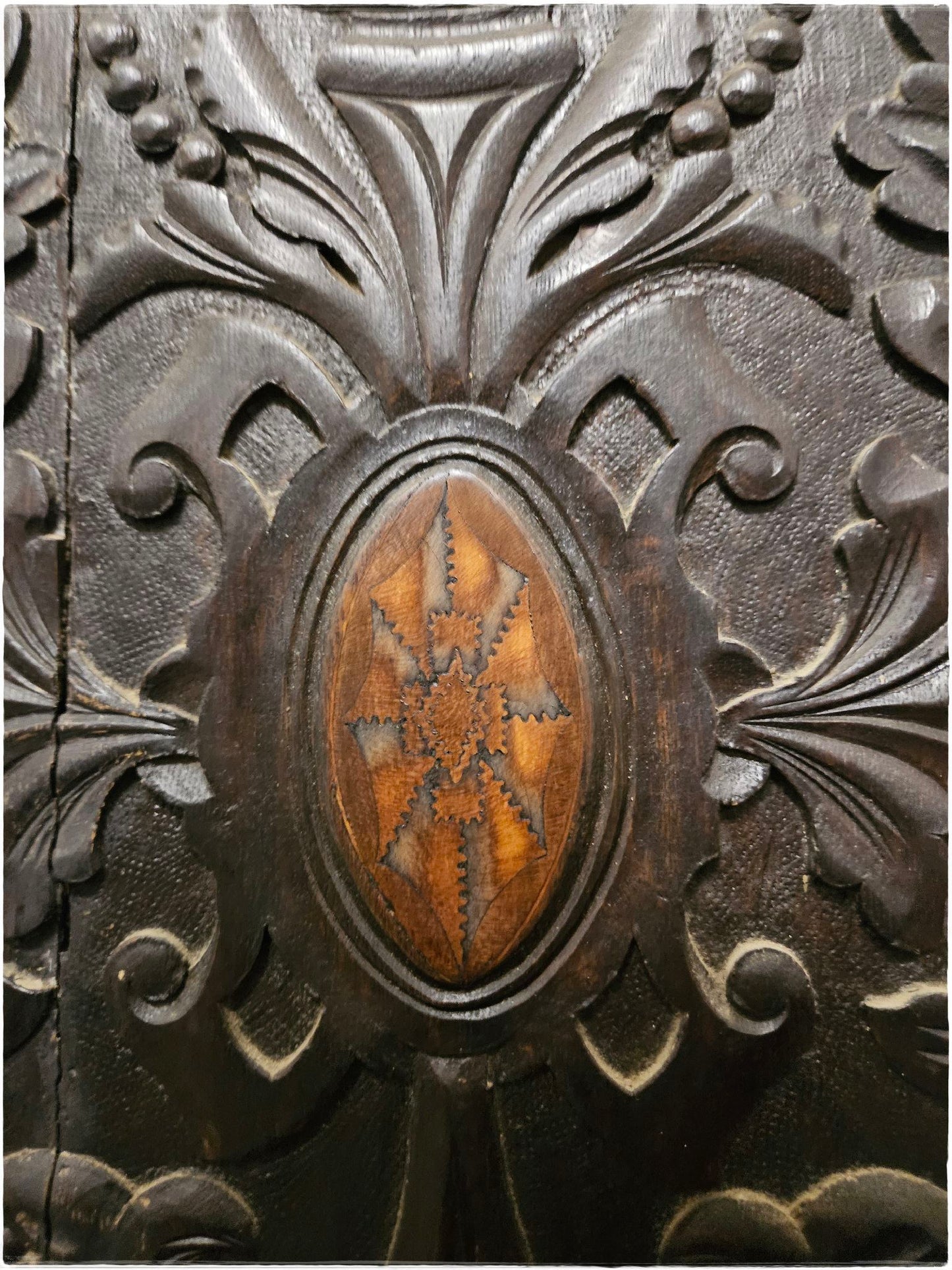 Ornately carved corner cabinet