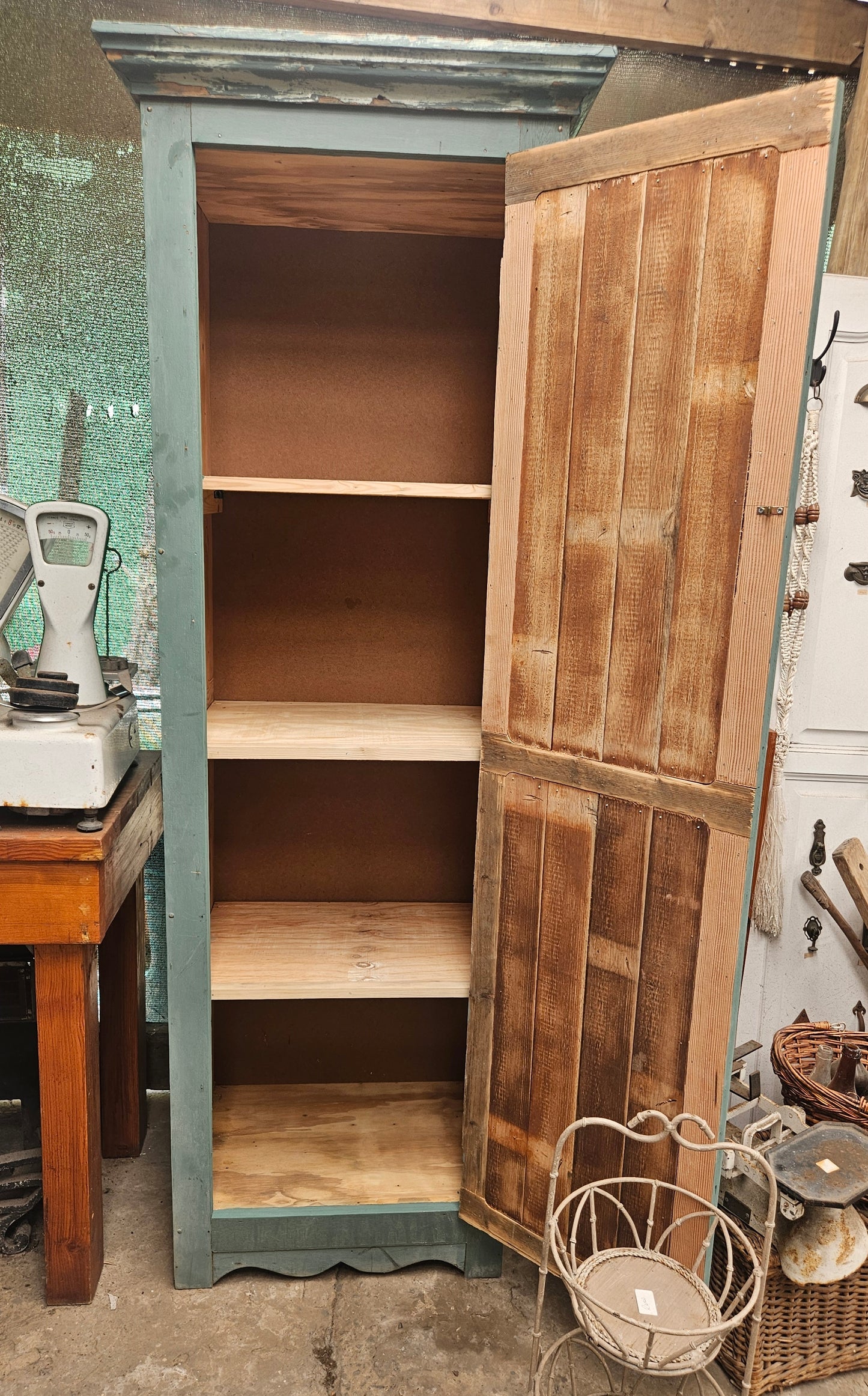 Green cabinet with shelving