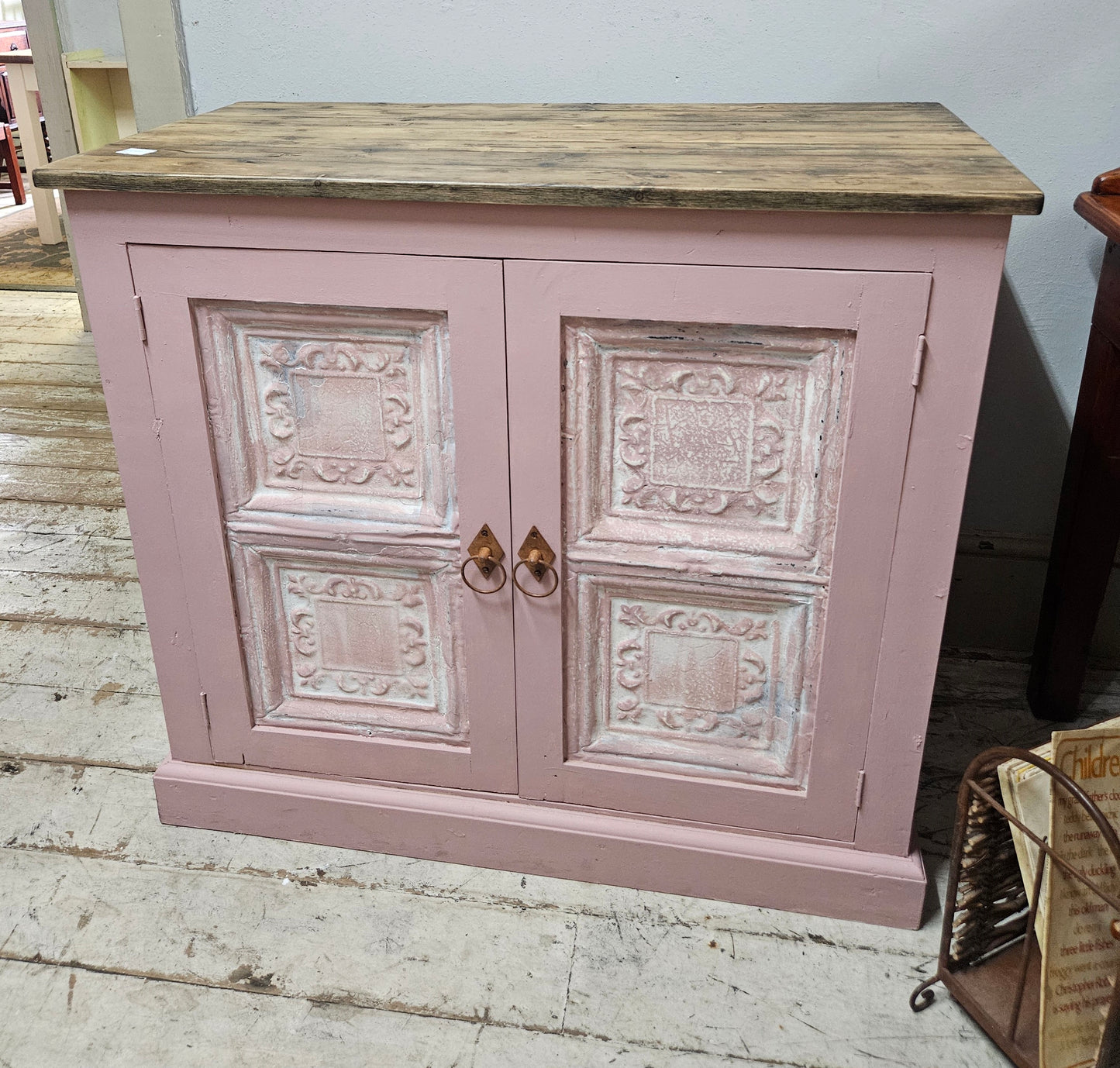 Base cabinet with iron paneled doors