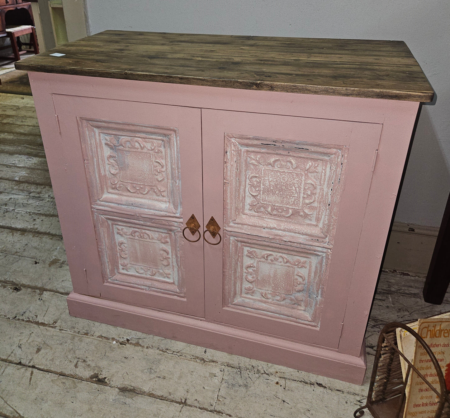Base cabinet with iron paneled doors