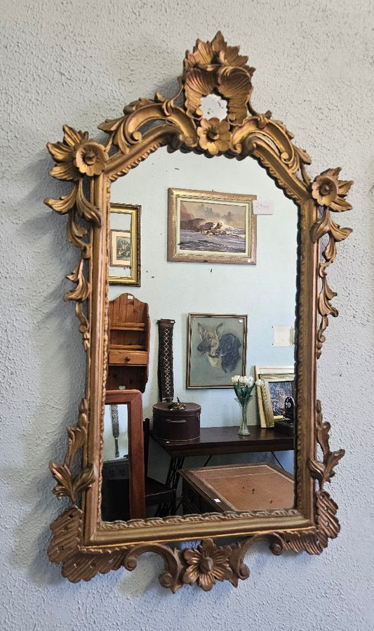 Ornate gold framed mirror