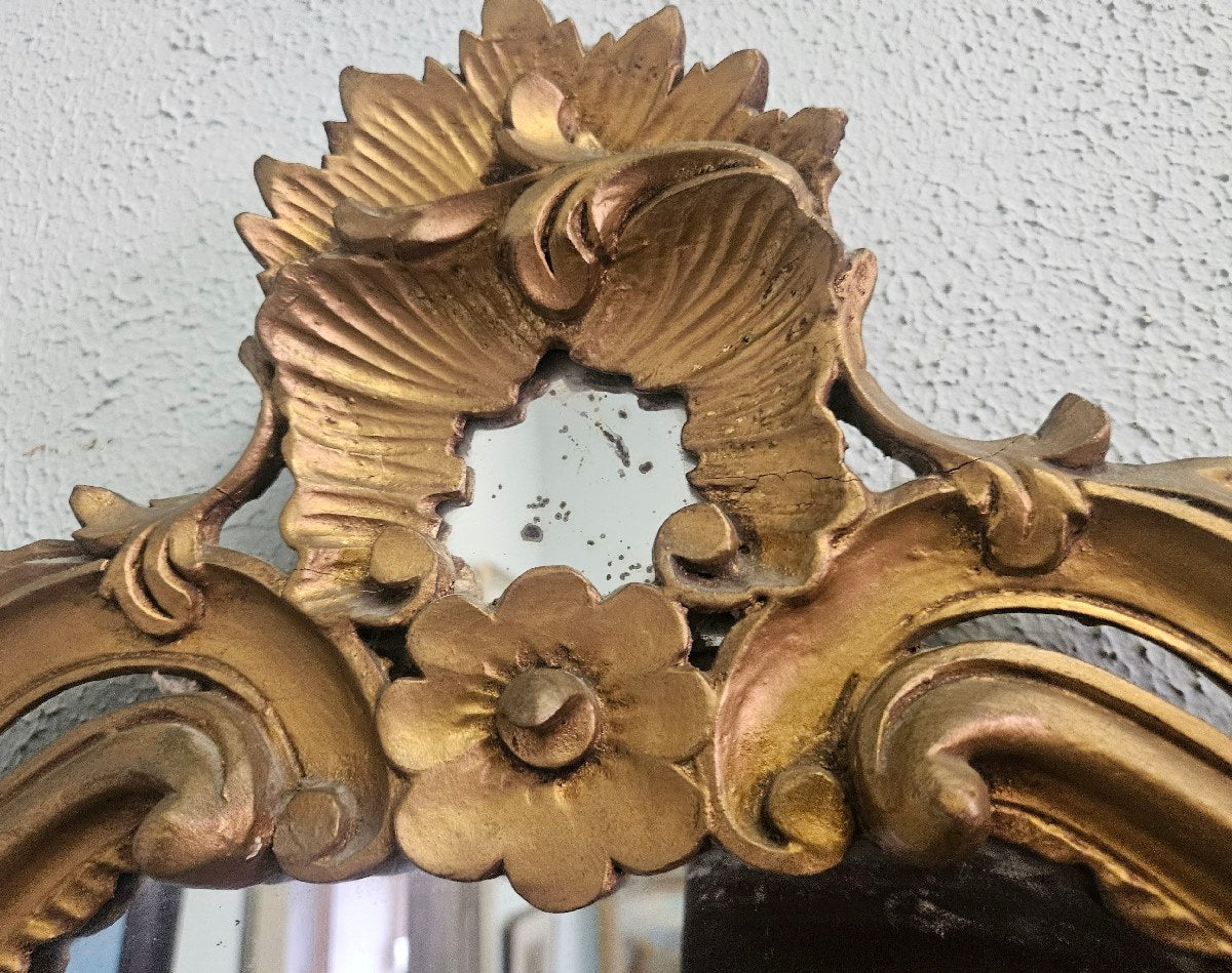 Ornate gold framed mirror