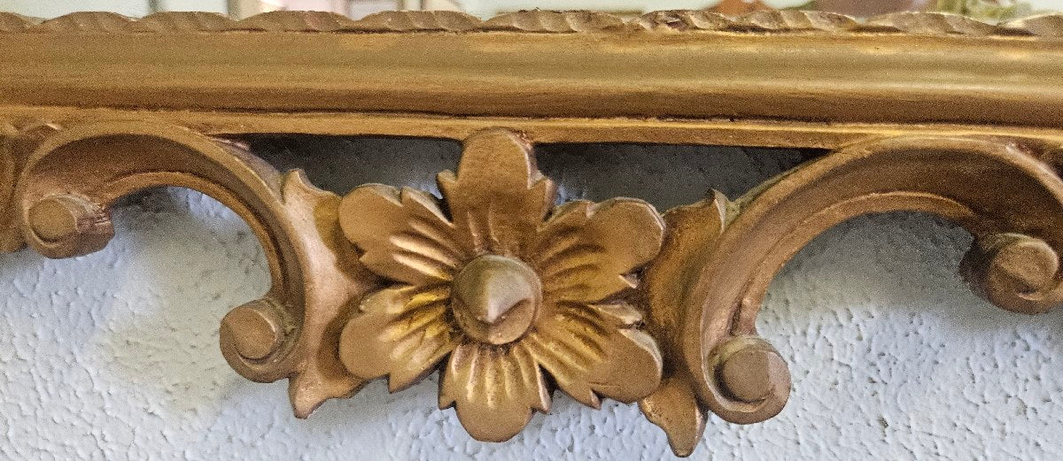 Ornate gold framed mirror