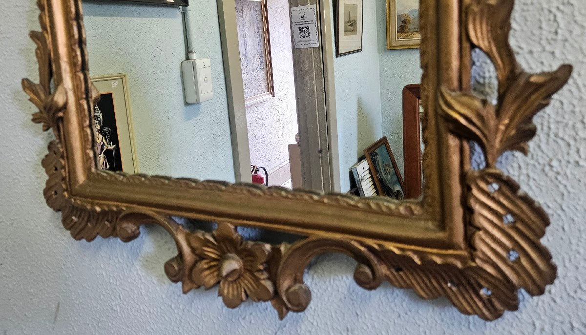 Ornate gold framed mirror