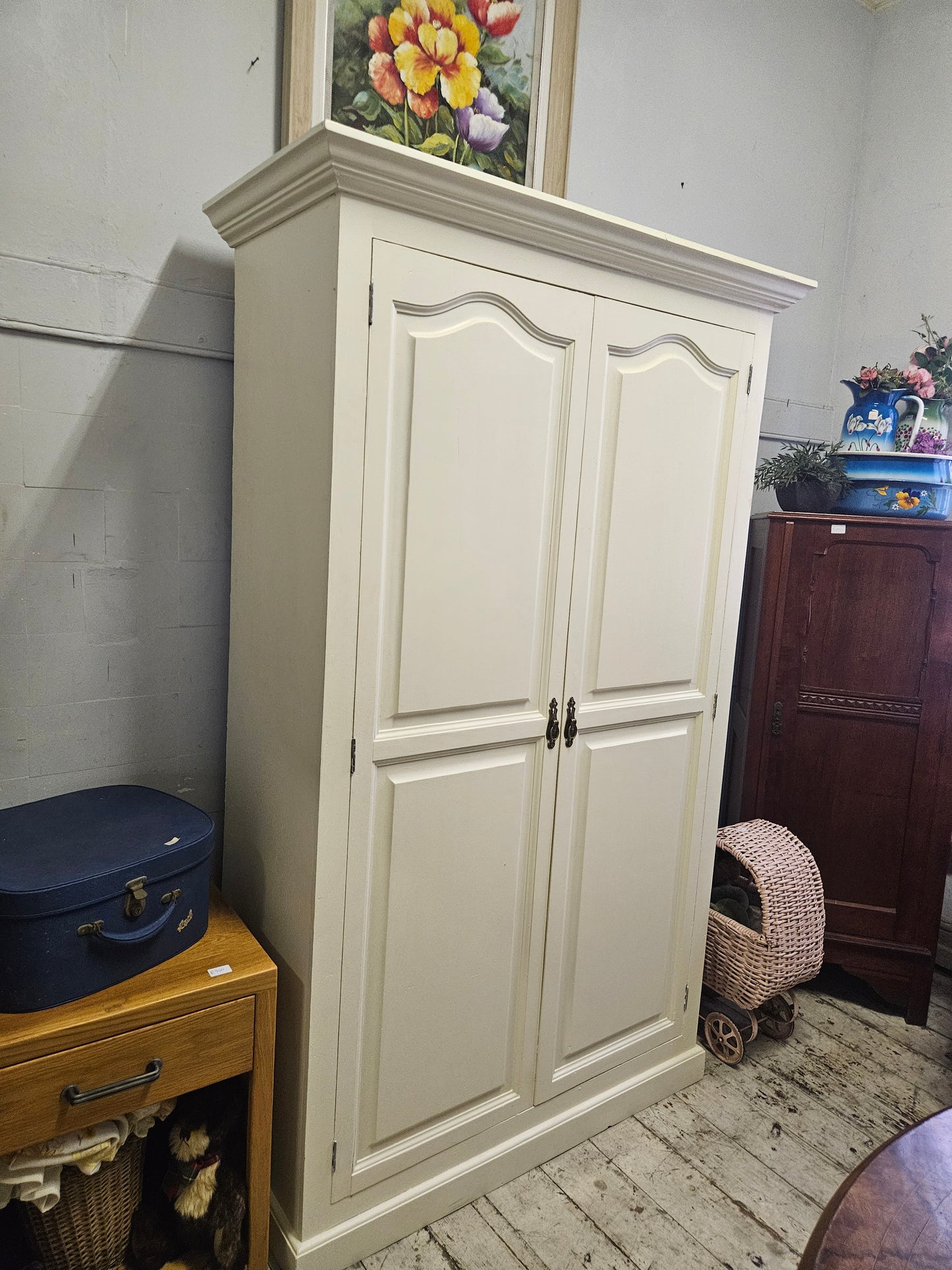 Painted wardrobe with hanging and shelving space