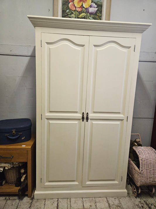 Painted wardrobe with hanging and shelving space