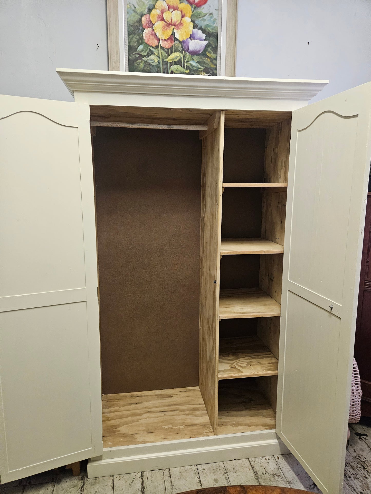 Painted wardrobe with hanging and shelving space