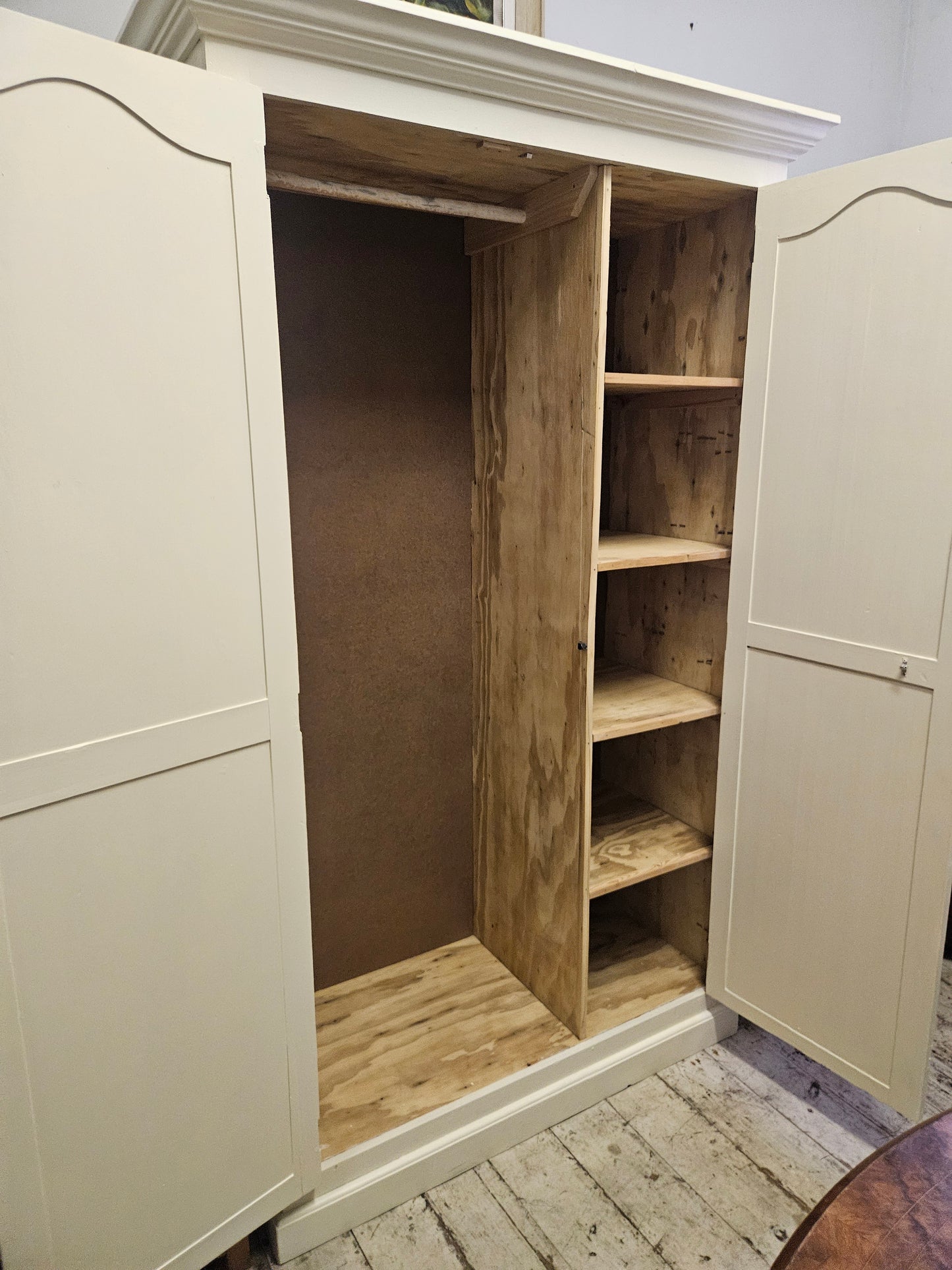 Painted wardrobe with hanging and shelving space