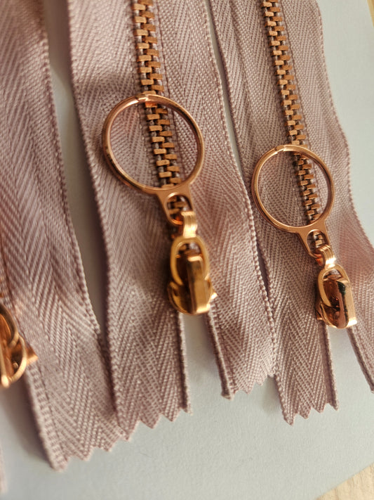 Rose gold and mauve zips