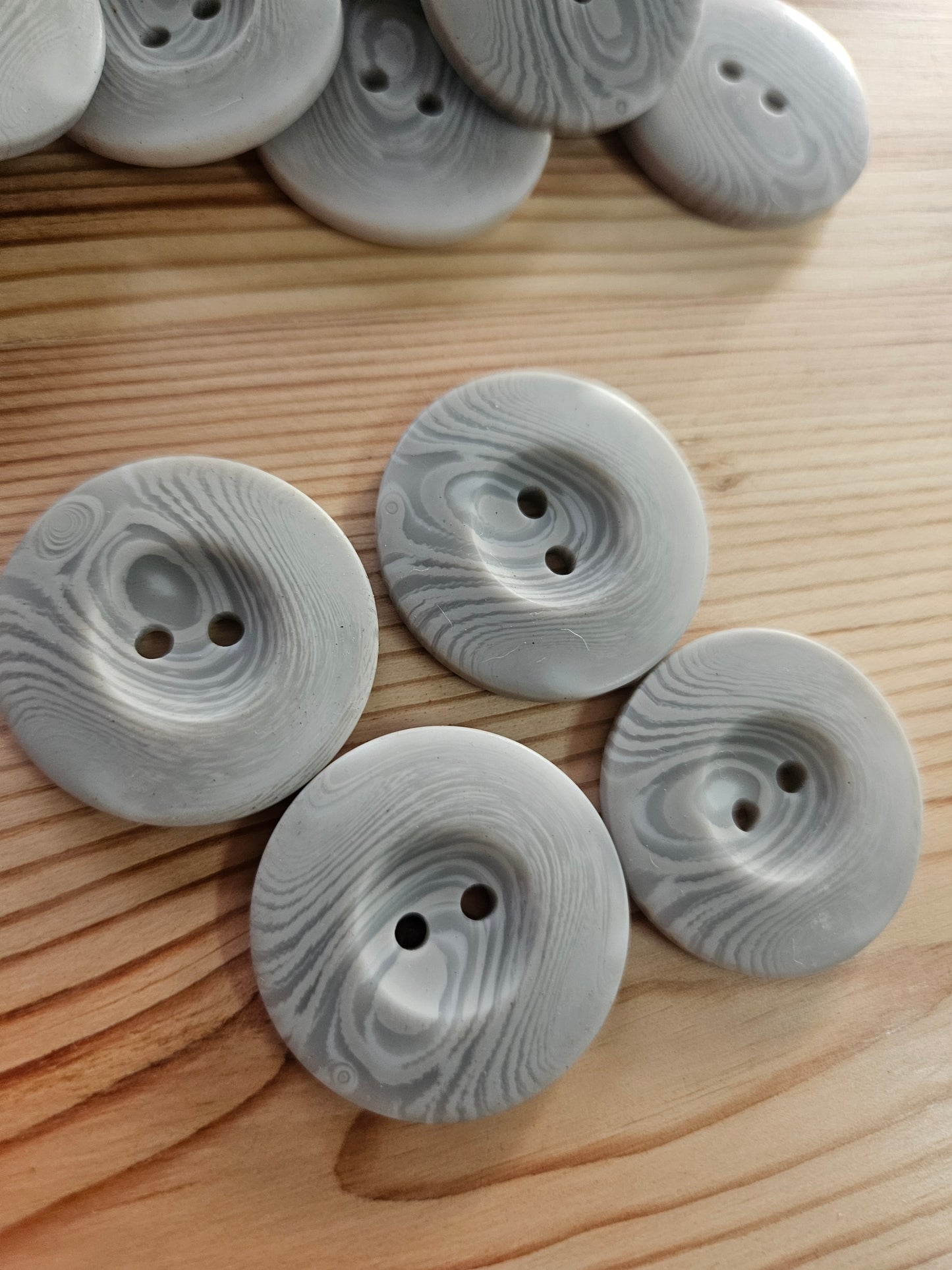 Large grey swirl buttons