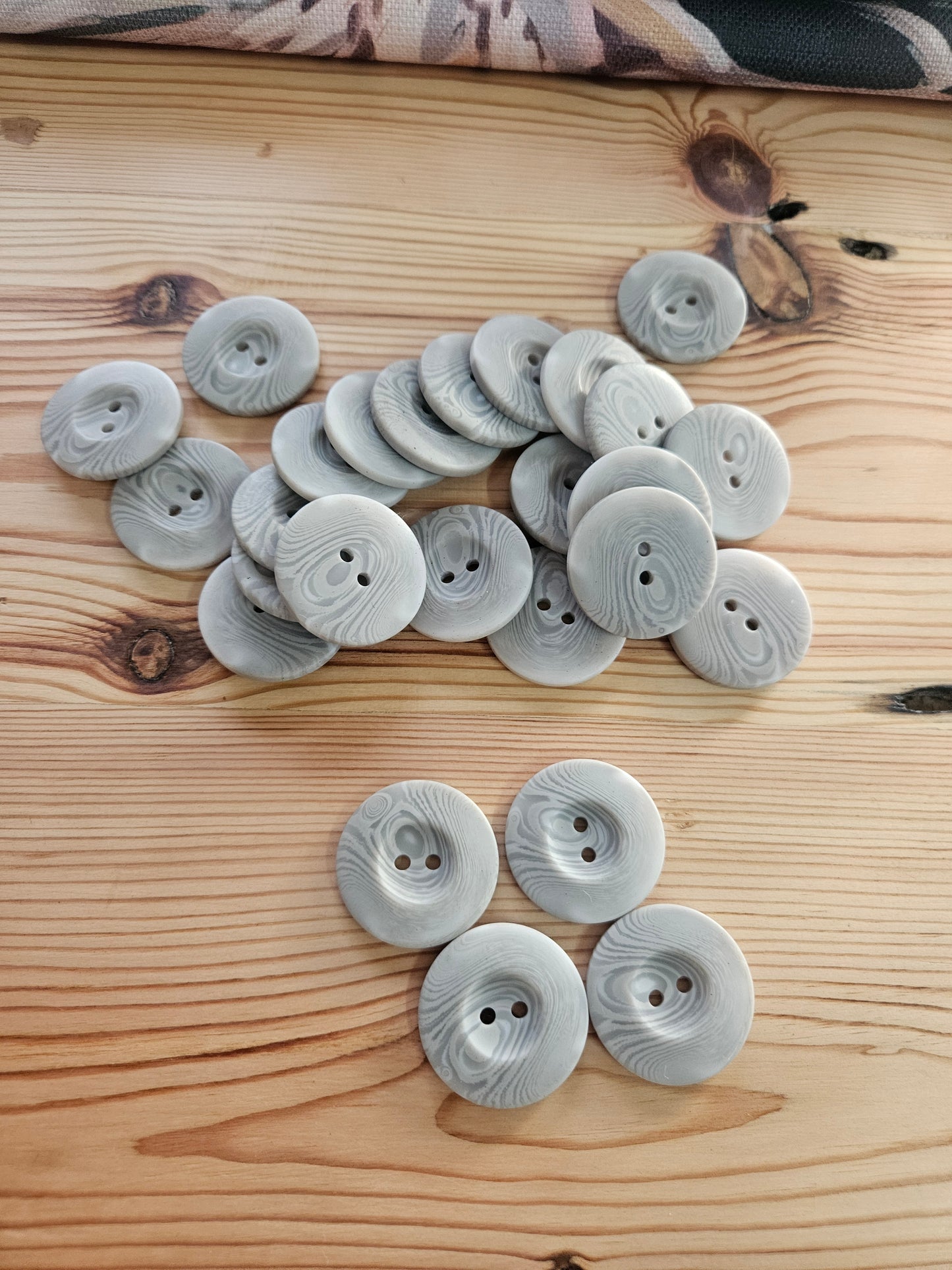 Large grey swirl buttons