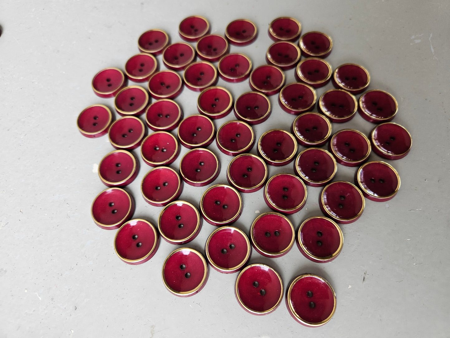Burgundy and gold buttons