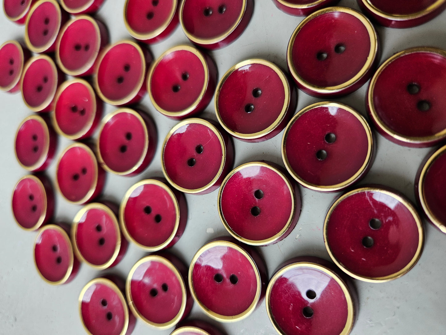 Burgundy and gold buttons