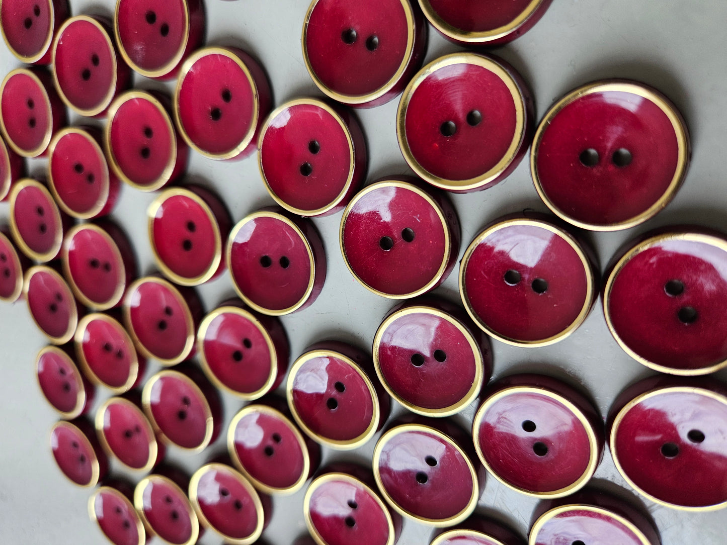 Burgundy and gold buttons