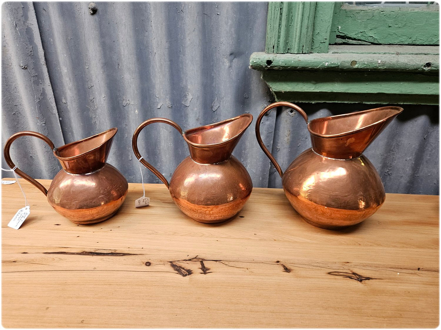 Graduated set of 3 De Klerk copper jugs