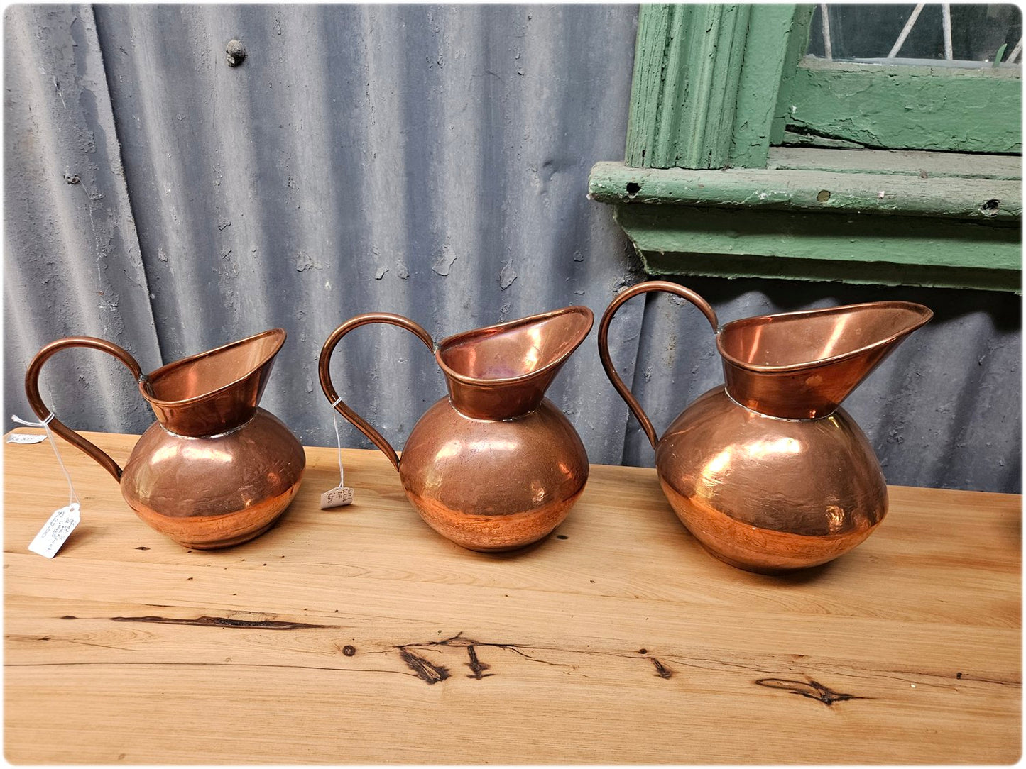 Graduated set of 3 De Klerk copper jugs