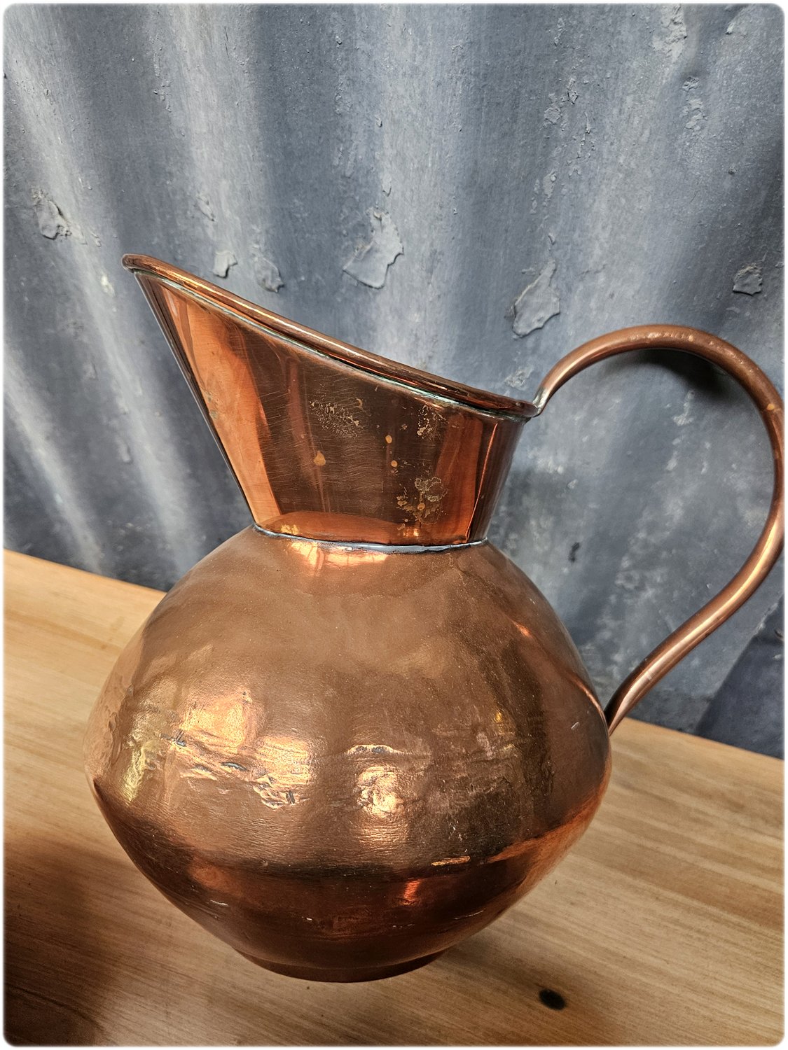 Graduated set of 3 De Klerk copper jugs