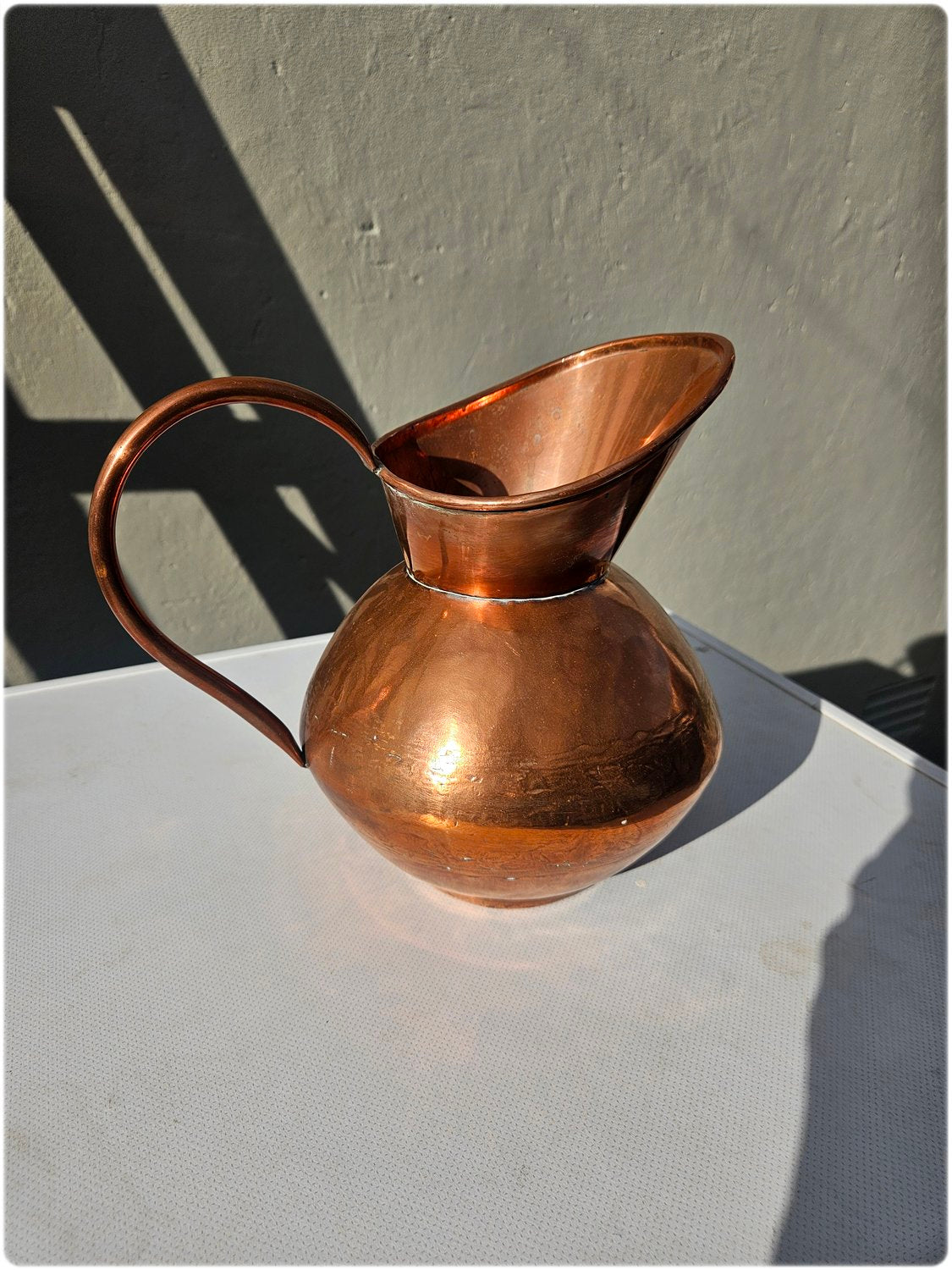 Graduated set of 3 De Klerk copper jugs
