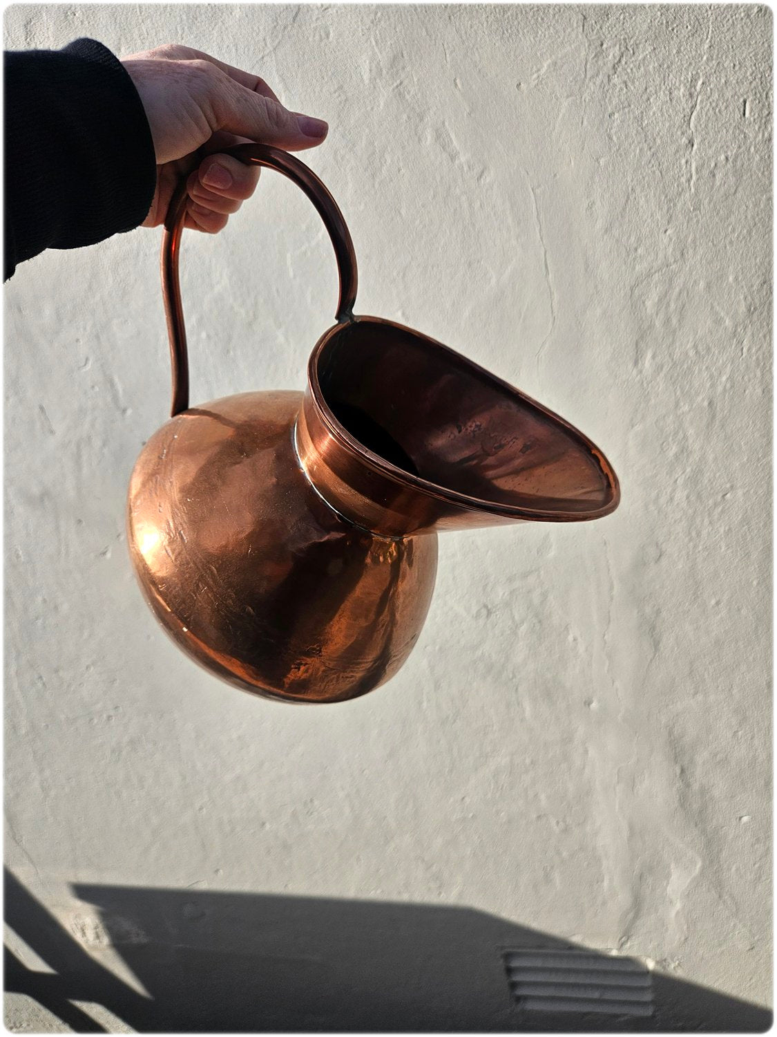 Graduated set of 3 De Klerk copper jugs