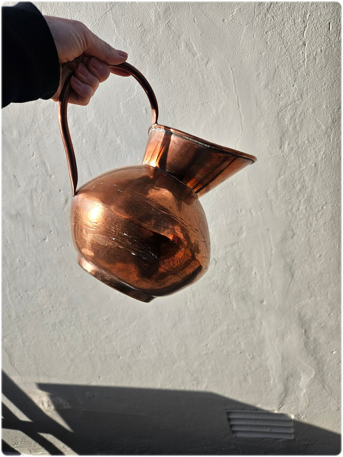 Graduated set of 3 De Klerk copper jugs