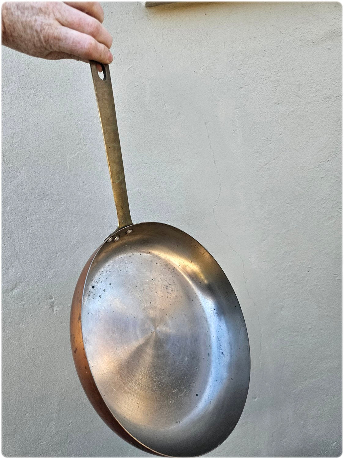 Copper pan with solid brass handle