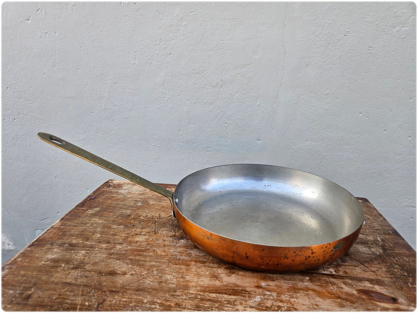 Copper pan with solid brass handle