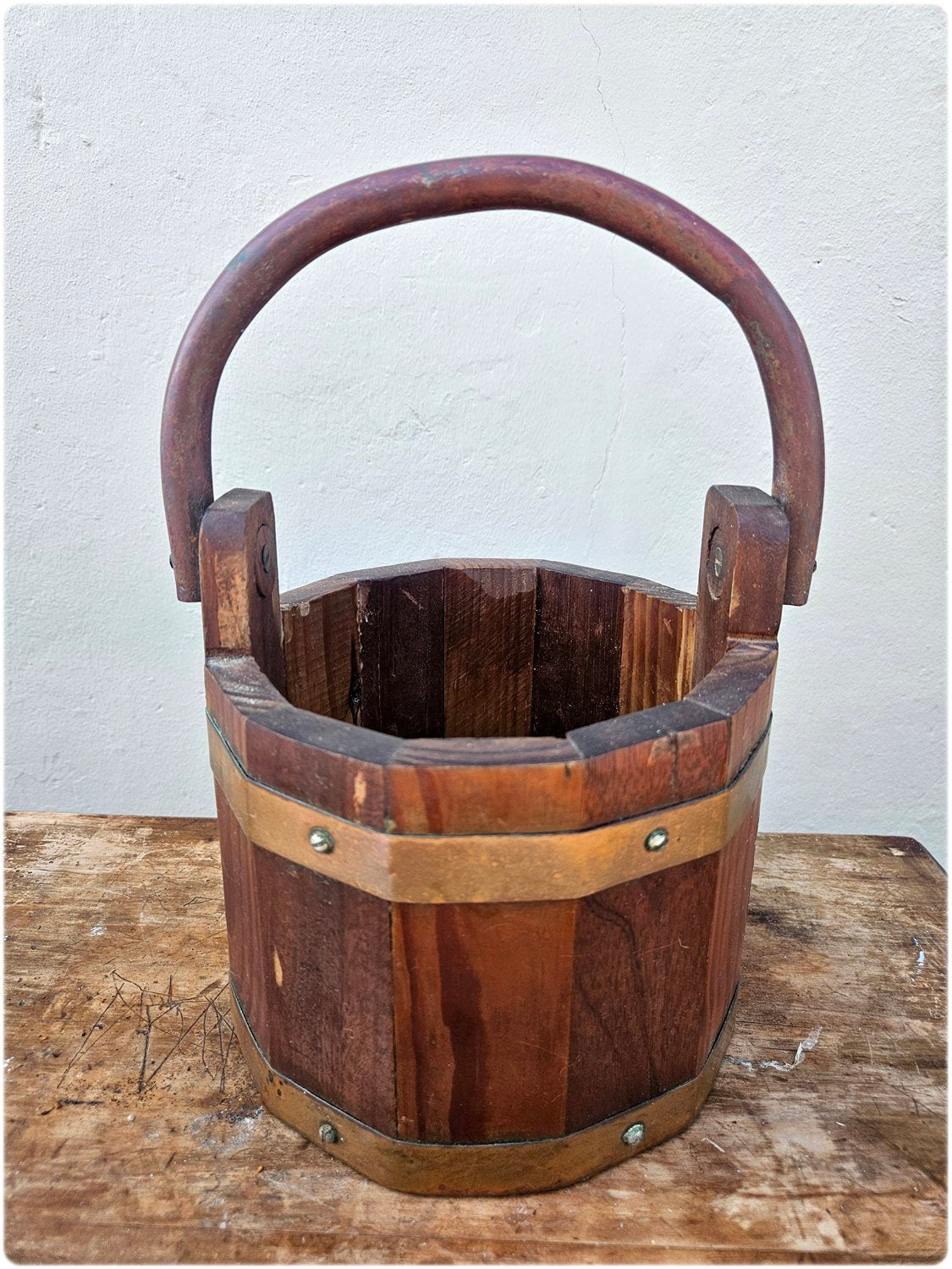 Wooden bucket with copper details