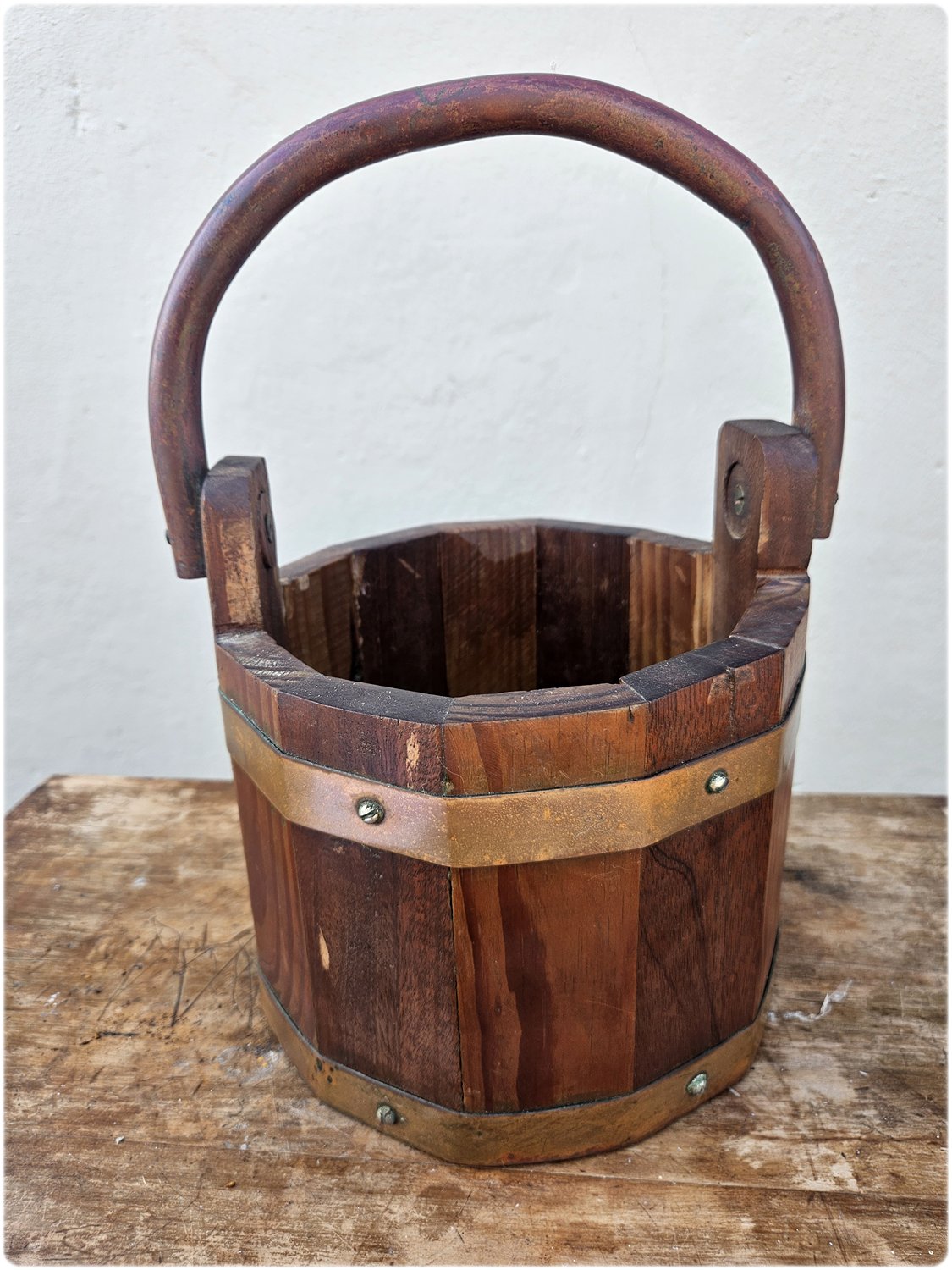 Wooden bucket with copper details